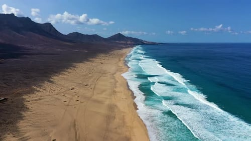 Beach with turquoise water on Fuerteventura island, Spain, Canary islands. Aerial view of sand beach