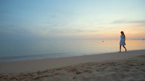 Calm Sea Shore with Crushing Waves on Sandy Beach at Sunrise