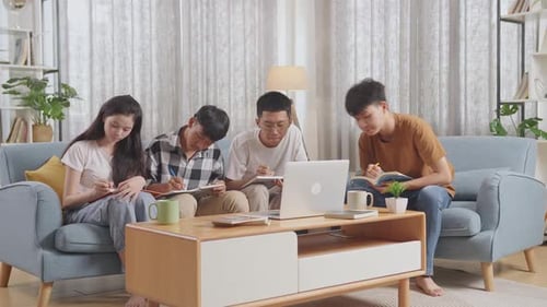 Students Studying Together on Couch With Laptop