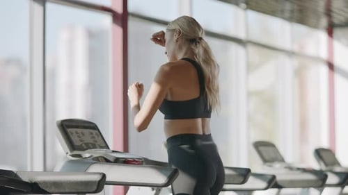 Running Woman Practicing On Treadmill Machine In Fitness Gym. Pretty Sportswoman Training Cardio ...
