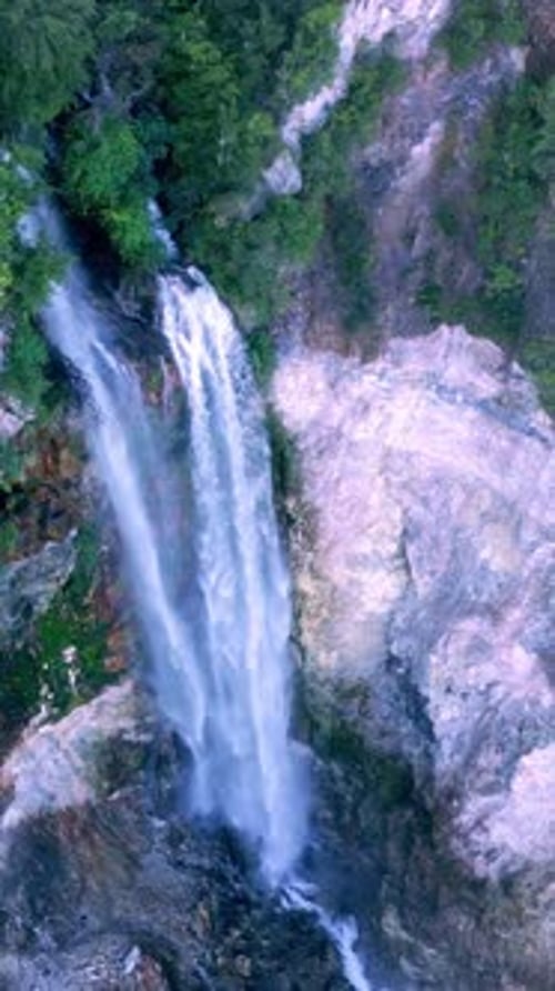 Aerial View Waterfall of Mountain Falling in Green Nature of Forest Landscape