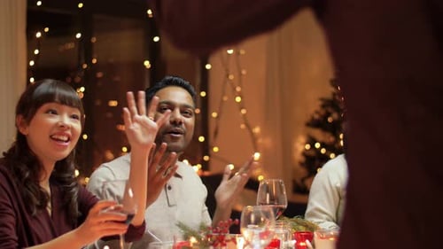 Friends Celebrate Christmas at Home Dinner Party