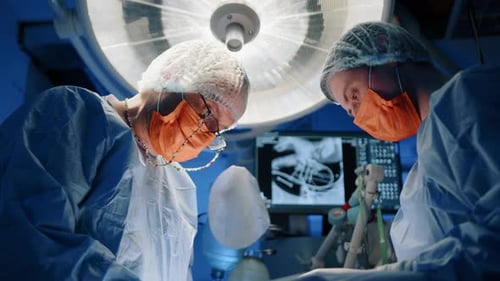 Surgeons Working in Operating Room at Night