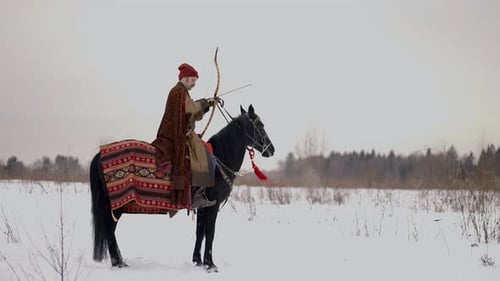 Archer on Horseback Man in Old Gown Holding Bow and Arrow Royal Hunt History Reconstruction
