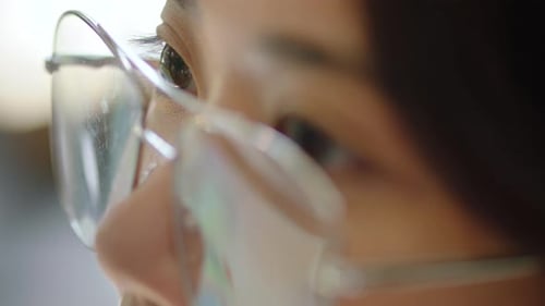 Zoom, eyes with glasses reflection woman from Japan or online vision eye with computer