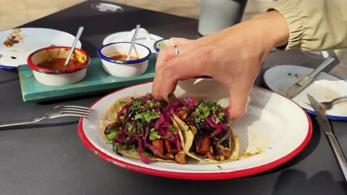 Delicious Tacos with Red Onions and Fresh Herbs