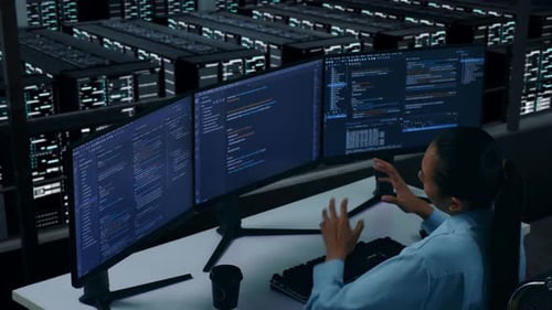 Side View Of Tired Asian Woman Developer Stretching While Write Code In Data Center