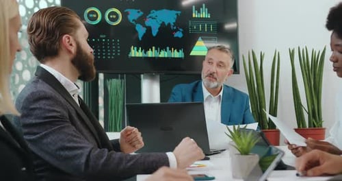 Diverse Team Collaborates in Modern Office Meeting