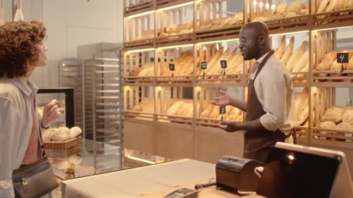 Female Customer Choosing Bread at Bakery