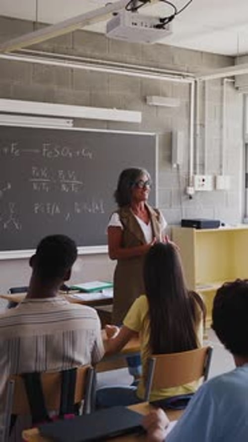 Teacher Lecturing Students in Classroom