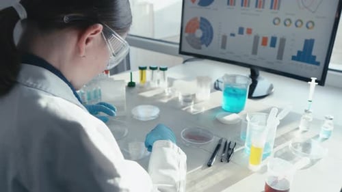 Scientist Working on Experiments in Modern Lab