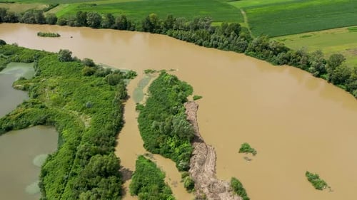 Aerial view of a river flowing on a plain by drone