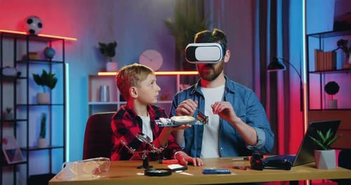 Father and Son Learn Science with VR Glasses