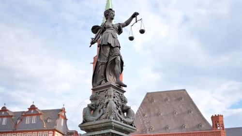 Justice fountain square statue and buildings in Frankfurt, Germany