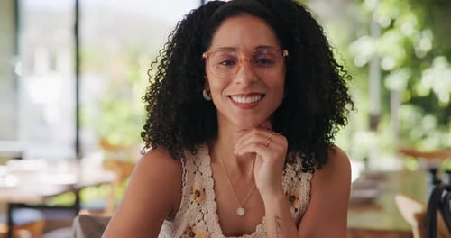 Happy, glasses and face of woman in cafe with confidence for break, holiday or weekend with relax