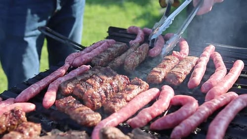 Sausages and Ground Meat Cooking on Grill