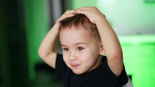 Smiling Toddler Dances with Joyful Hand Gestures