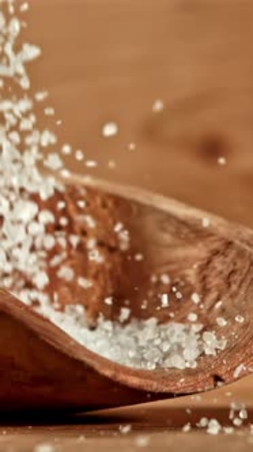 Salt Falls Into a Wooden Scoop Filmed on a Highspeed Camera at 1000 Fps
