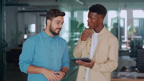 Team of Two Busy Business Men Working Standing in Office Using Digital Tablet