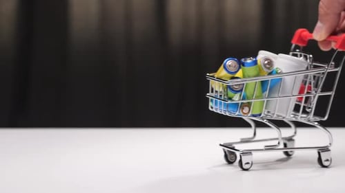 Shopping Cart Filled with Batteries Close Up