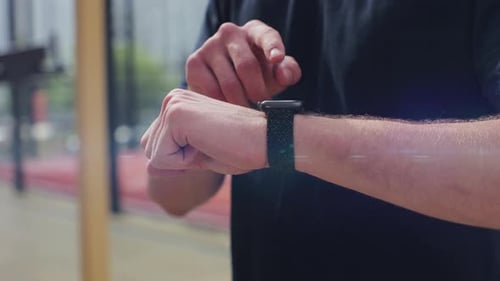 Close Up of Active Sport Man in the Sport Ground Check Health Indicator and Heart Rate on Smartwatch