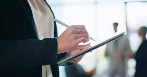 Woman Using Stylus on Tablet in Office