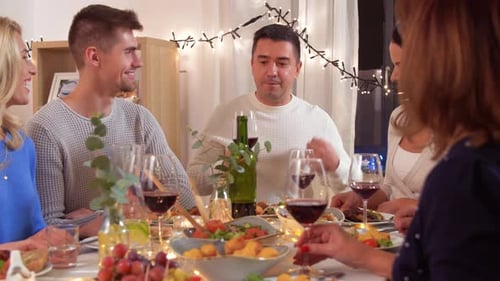 Friends and Family Enjoy a Lively Dinner Party