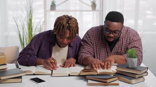 Two Friends Studying Together at a Table