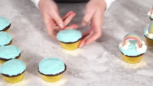 Decorating Chocolate Cupcakes with Buttercream Frosting and Rainbow Candy