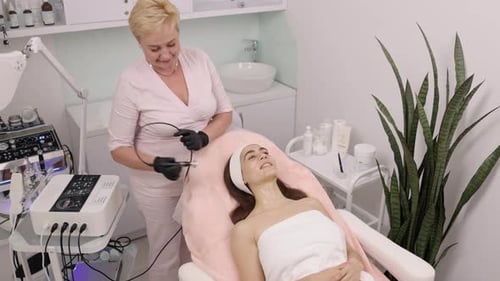 Woman Receiving a Facial Treatment at a Beauty Clinic
