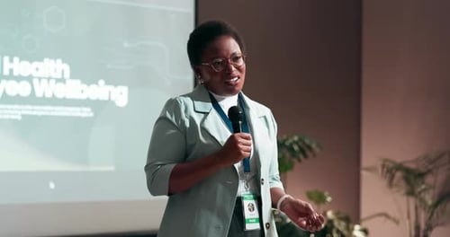 Black woman, presentation and screen with mic for seminar, conference or convention at office