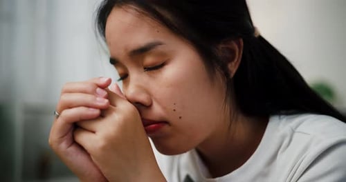 Woman Indoors Looking Worried and Upset