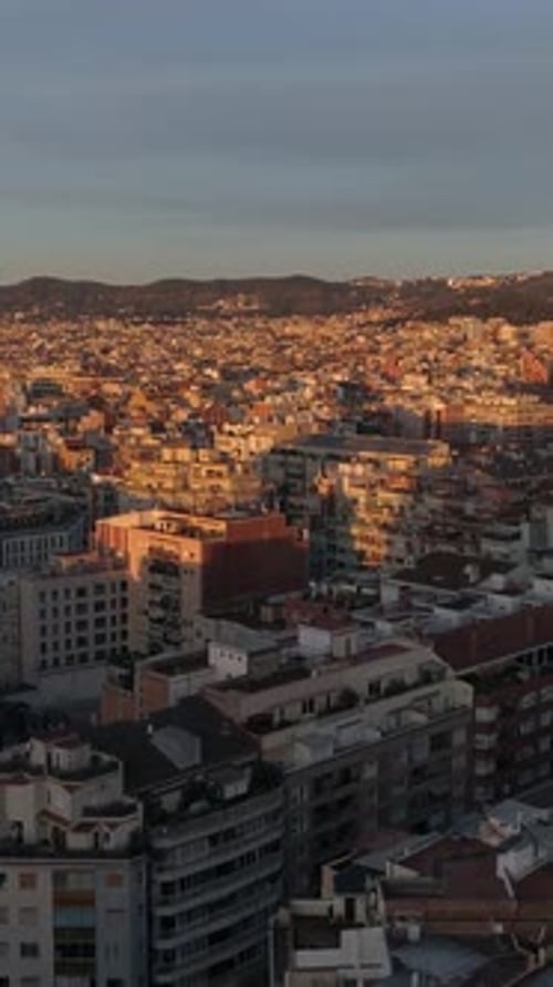 Vertical Video of Drone Shot Above Barcelona Cityscape Spain