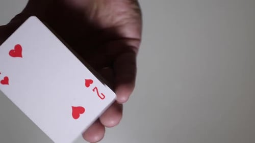 Playing Cards Spread in Hand Revealing Full Deck