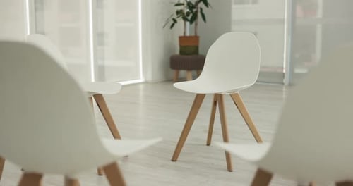 Therapy session, group or circle of empty chair for community meeting, wellness center