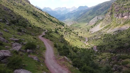 Spanish Pyrenees, Spain - Aerial Drone View of the Hiking Trail and Green Valley of Valle de Aguas T
