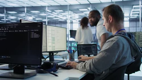 Programmer Requesting Help From Manager While Working on Computer in Data Center