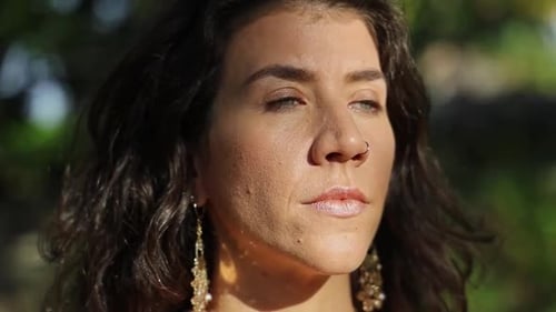 Woman in Sunlight with Eyes Closed