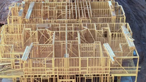 Wooden Apartment Building Under Construction in New Developing Suburban Area Development of