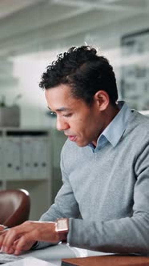 Documents, typing and businessman in office with report for finance dividend, profit or revenue