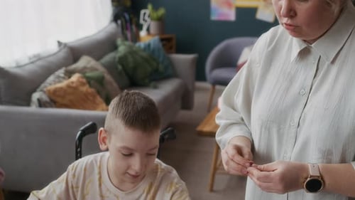 Teen Boy and Child Drawing with Adult at Home