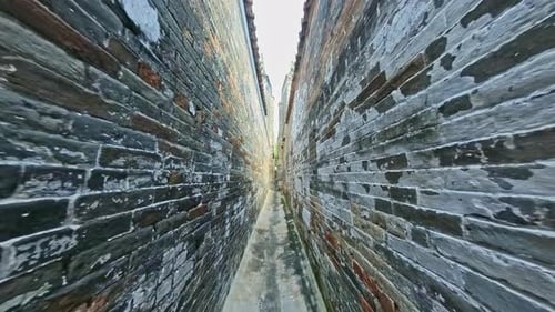Narrow brick wall path in Yuen Long, Hong Kong