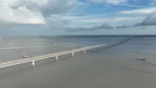 Aerial view of Padma bridge over the Padma river by day, Munshiganj, Bangladesh.