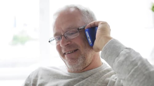 Smiling Senior Man Talking on Mobile Phone