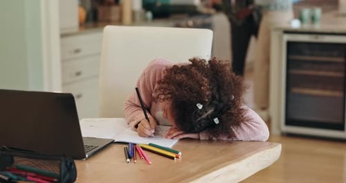 Child Writing Homework At Wooden Table Indoors