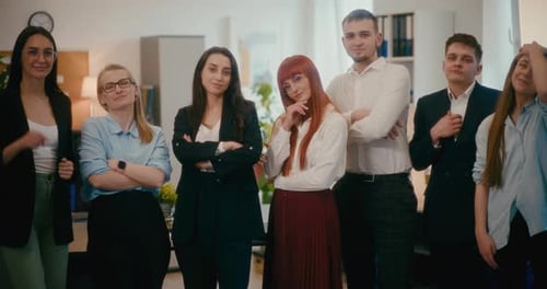 Confident Employees Standing Together in Office