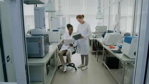 Scientists Working Together in Modern Laboratory