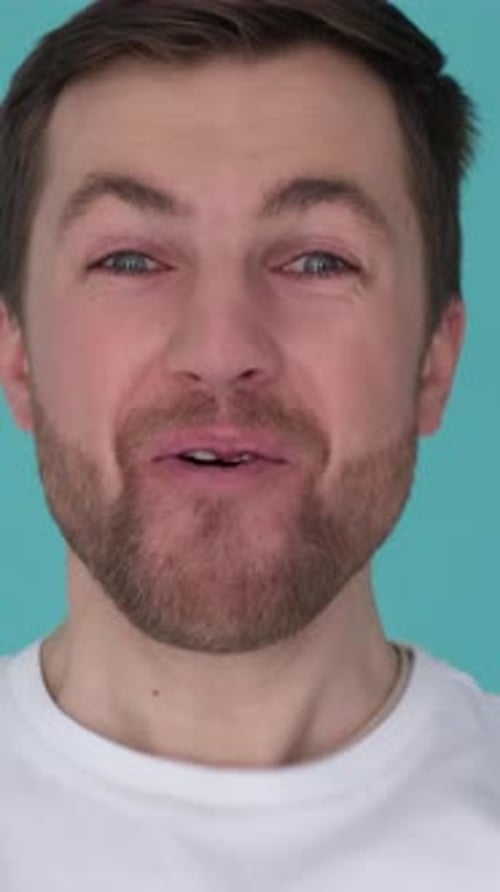 Man's Surprised Facial Expressions on Blue Background