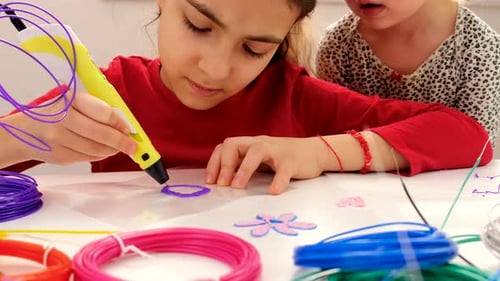 Girls Creating Art With a 3D Pen at Home