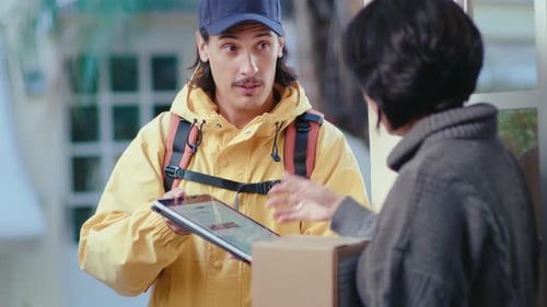 Courier Delivering Parcel to Woman and Giving Digital Tablet to Sign